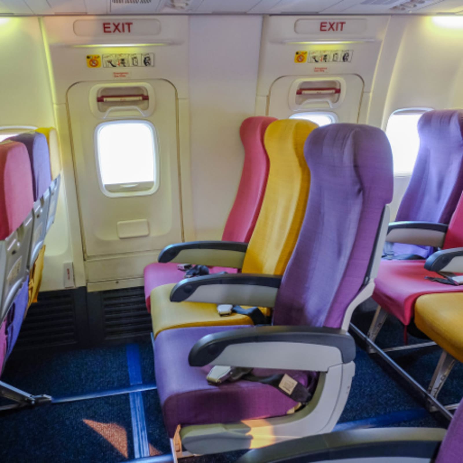 Airline seat with Three different color (Pink, Yellow, Purple)
