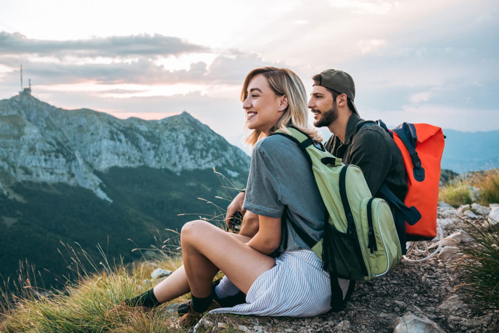 beautiful-young-couple-relaxing-after-hiking-and-taking-a-break.jpg