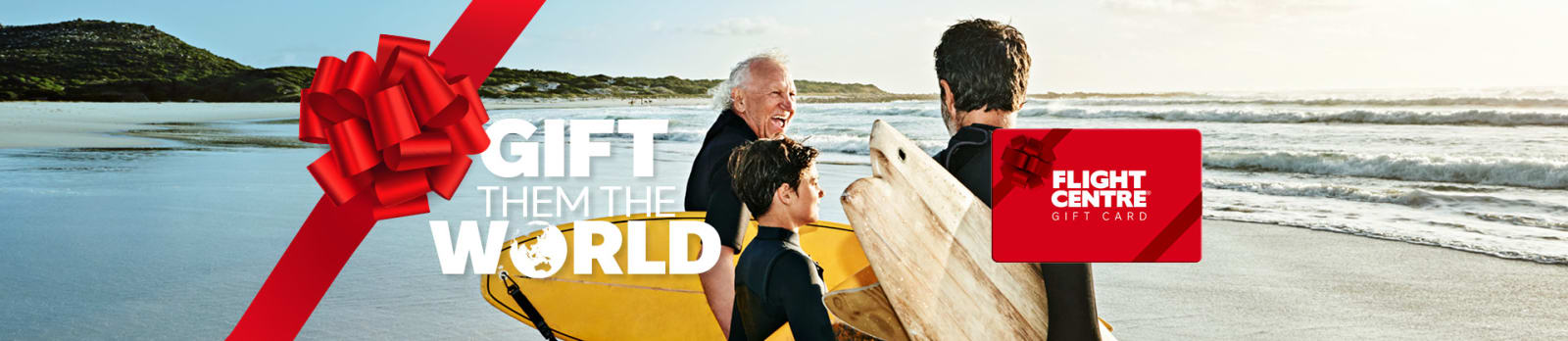 Gift them the world - flight centre. Grandfather, father and son on a beach ready to go surfing