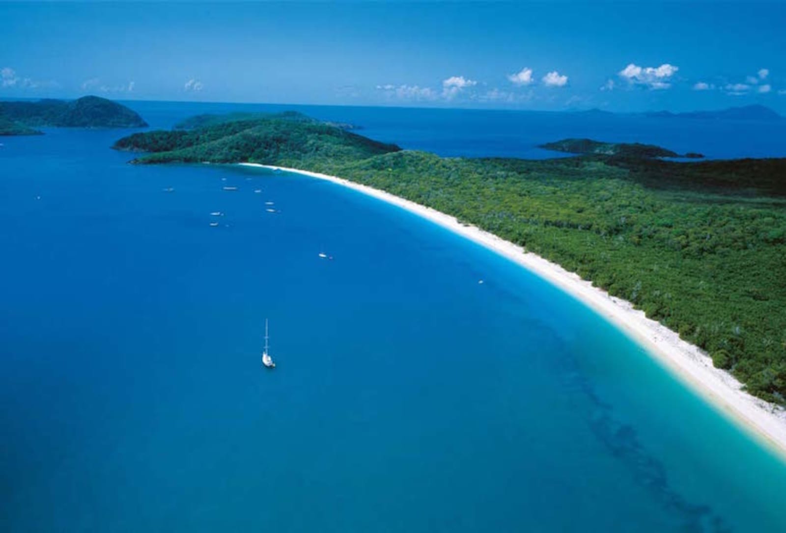 aerial view of white sandy beach and island in the Whitsunday islands Queensland