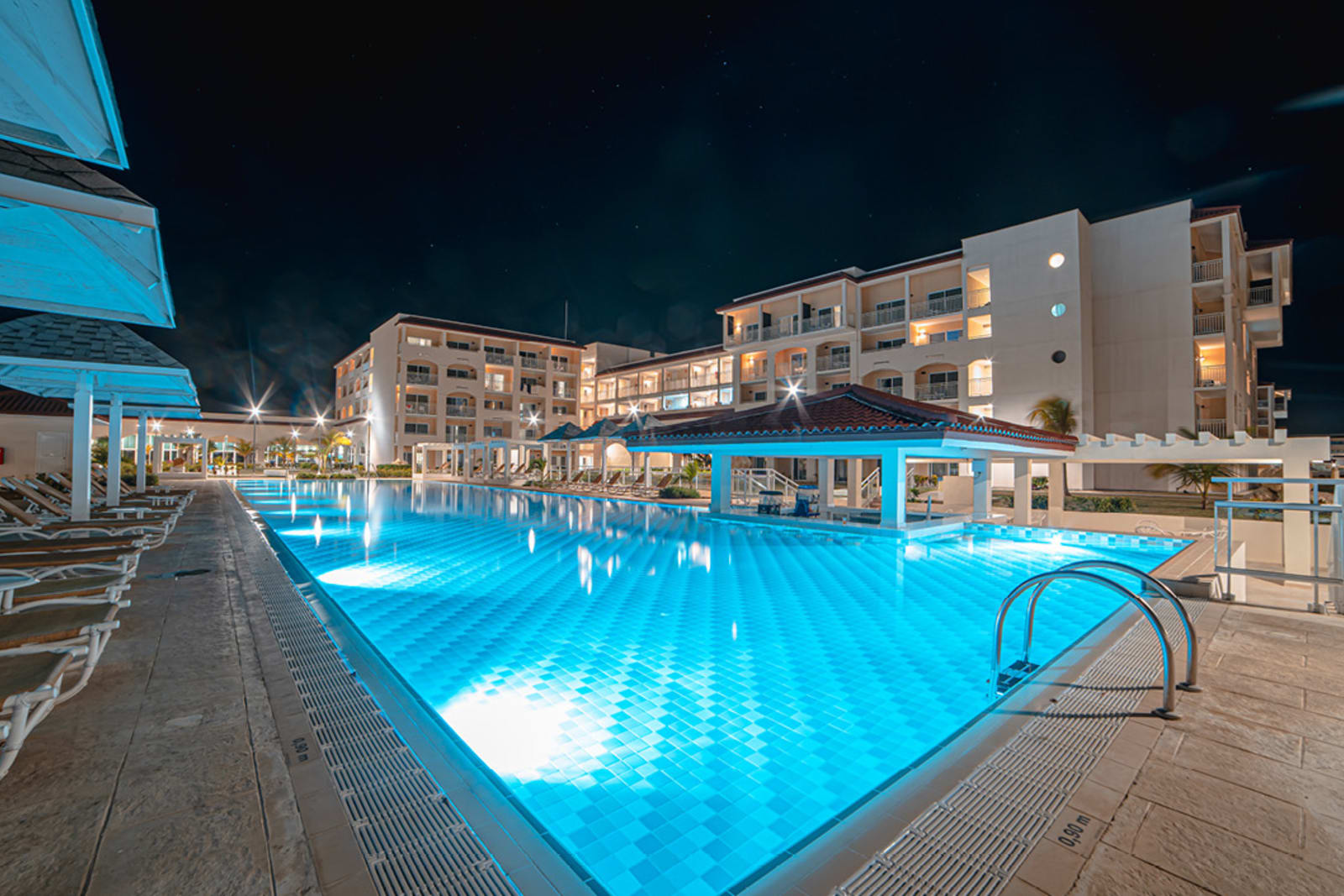 The pool at the adults-only all-inclusive Sanctuary at Grand Memories resort in Varadero, Cuba looks especially beautiful at night