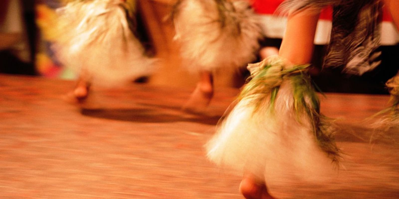 The feet of Polynesian dancers as the perform