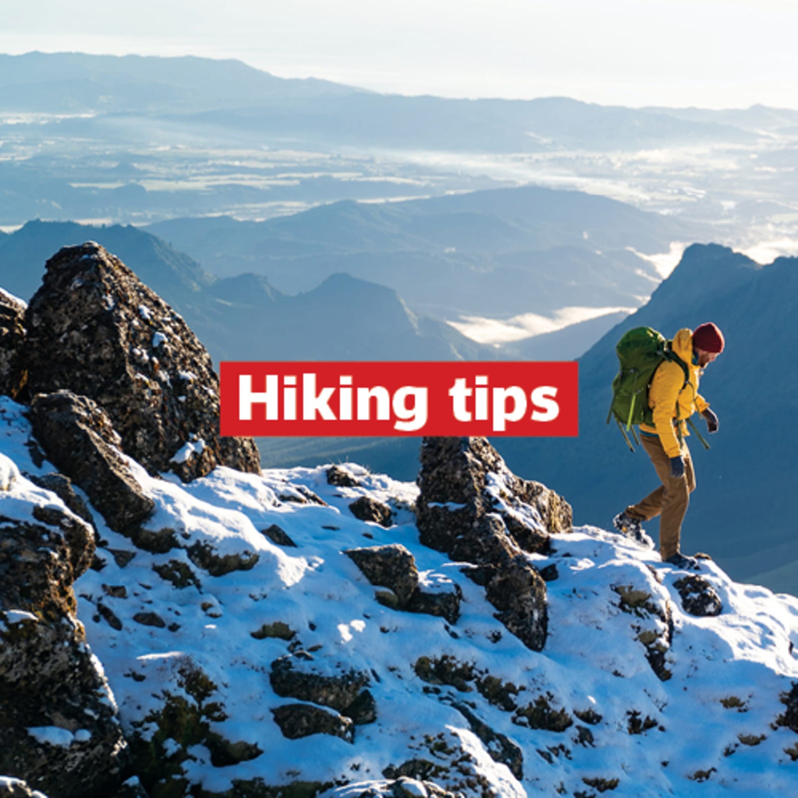 hiking tips with image of man hiking on snowy rocky mountain