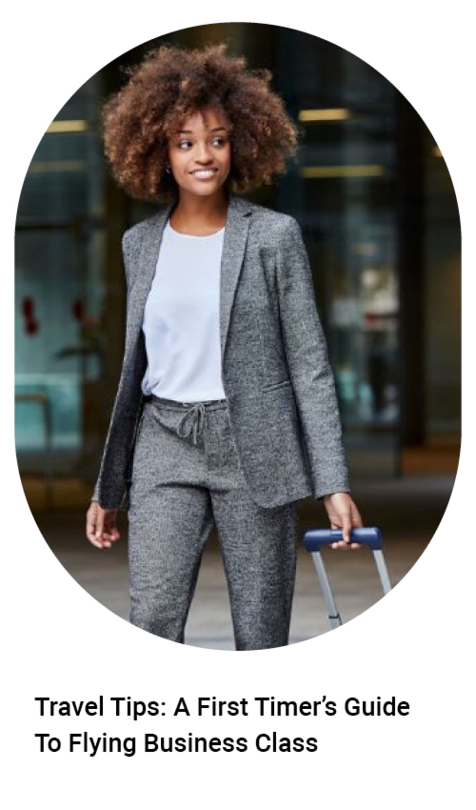 Businesswoman in a grey suit walking - Travel tips: a first timer's guide to flying business class
