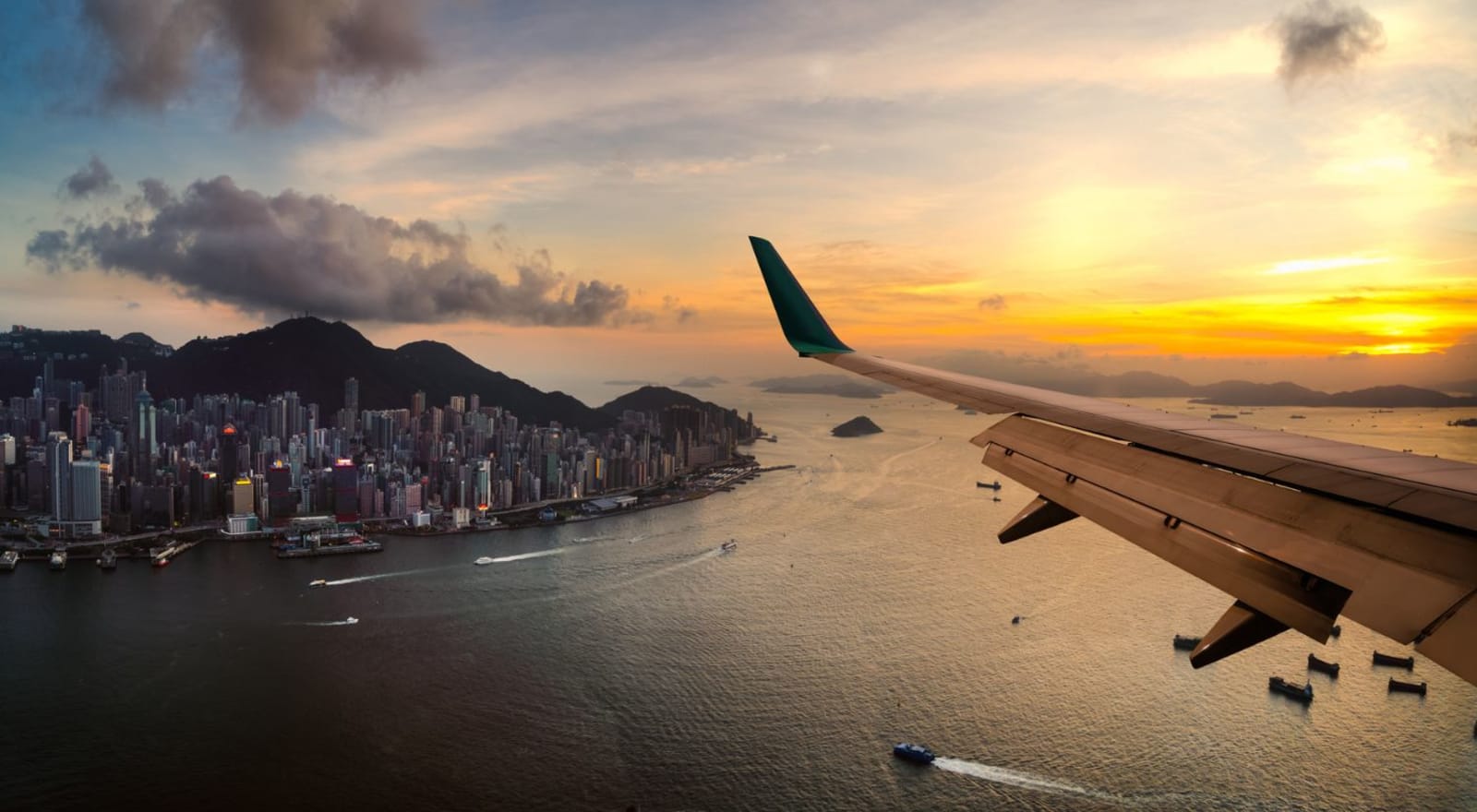 wing of plane while flying over island