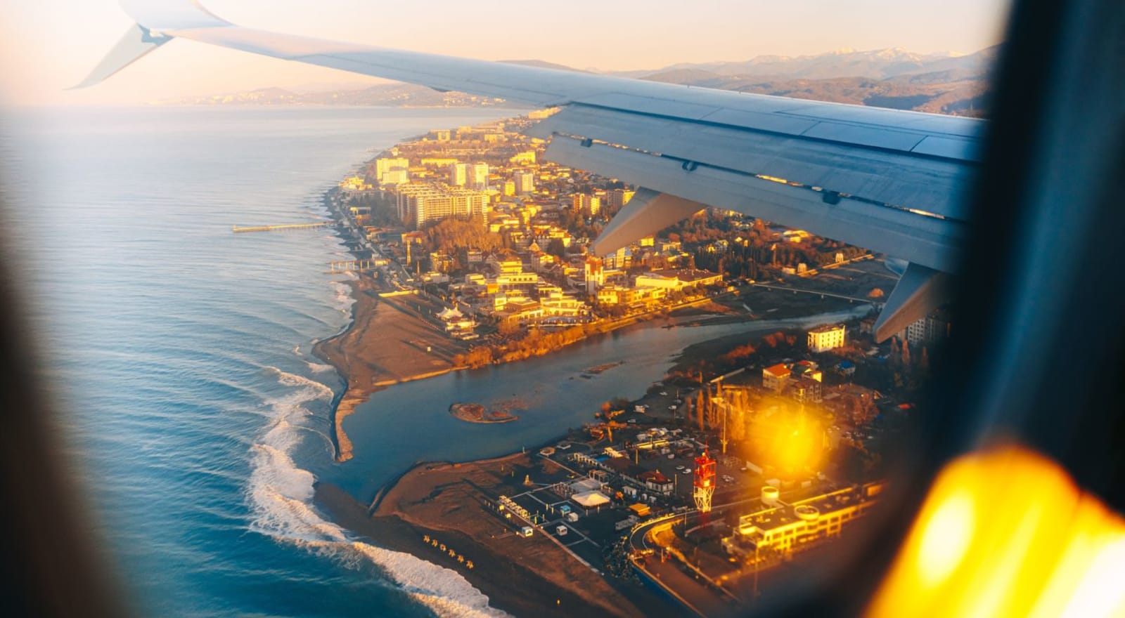 view of coastline out of plane window