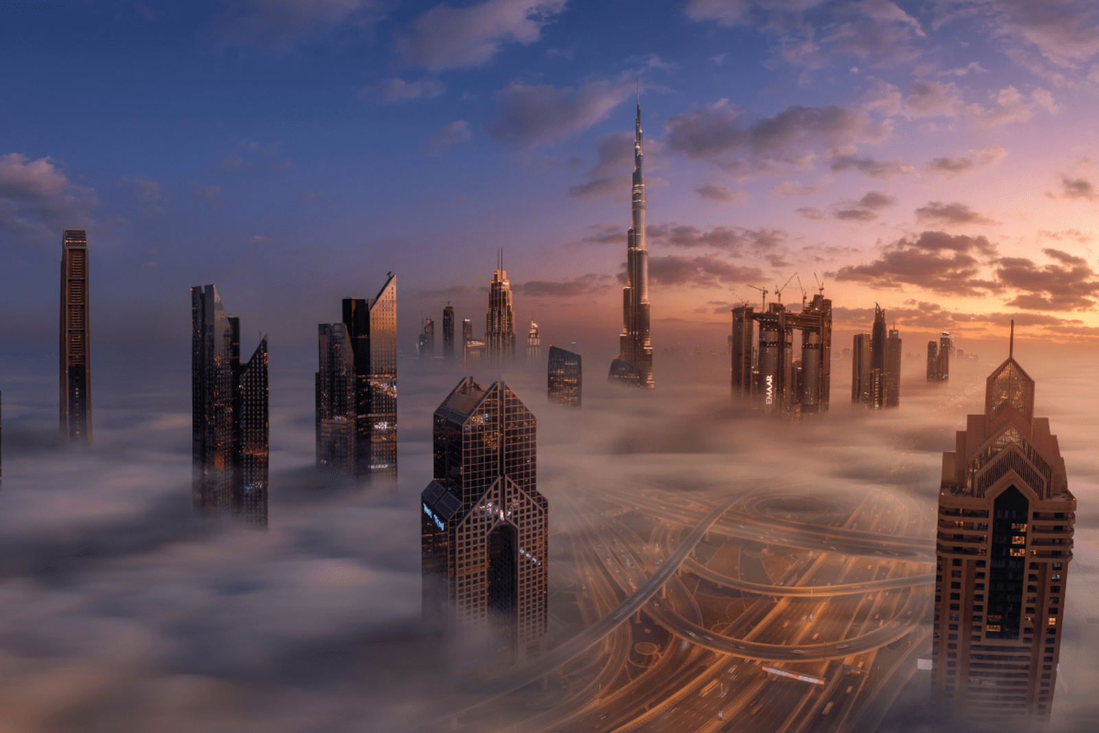 A low fog hangs beneath the Dubai cityscape