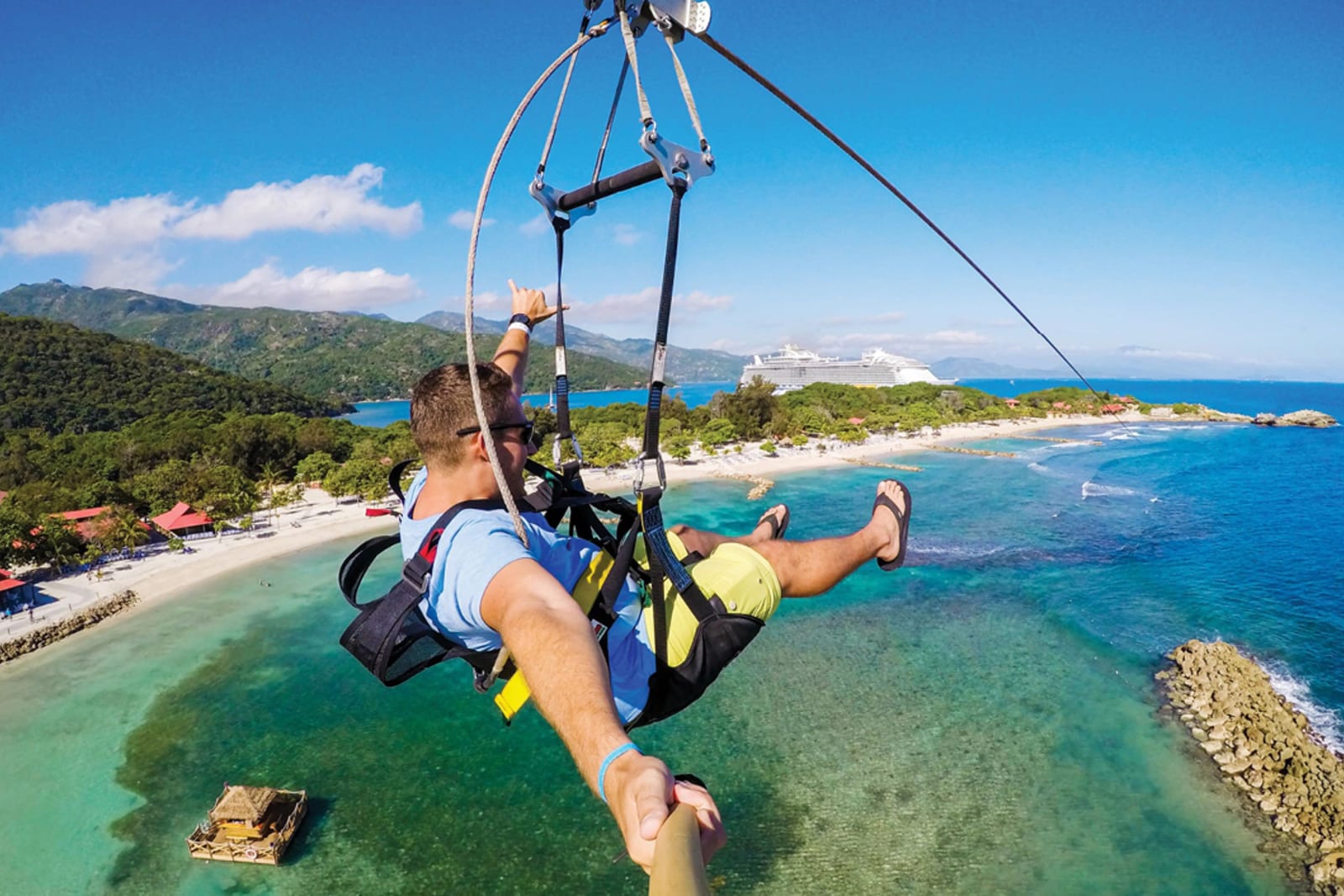 A cruise passengers riding the zipline at Labadee, a private island destination owened by Royal Caribbean International