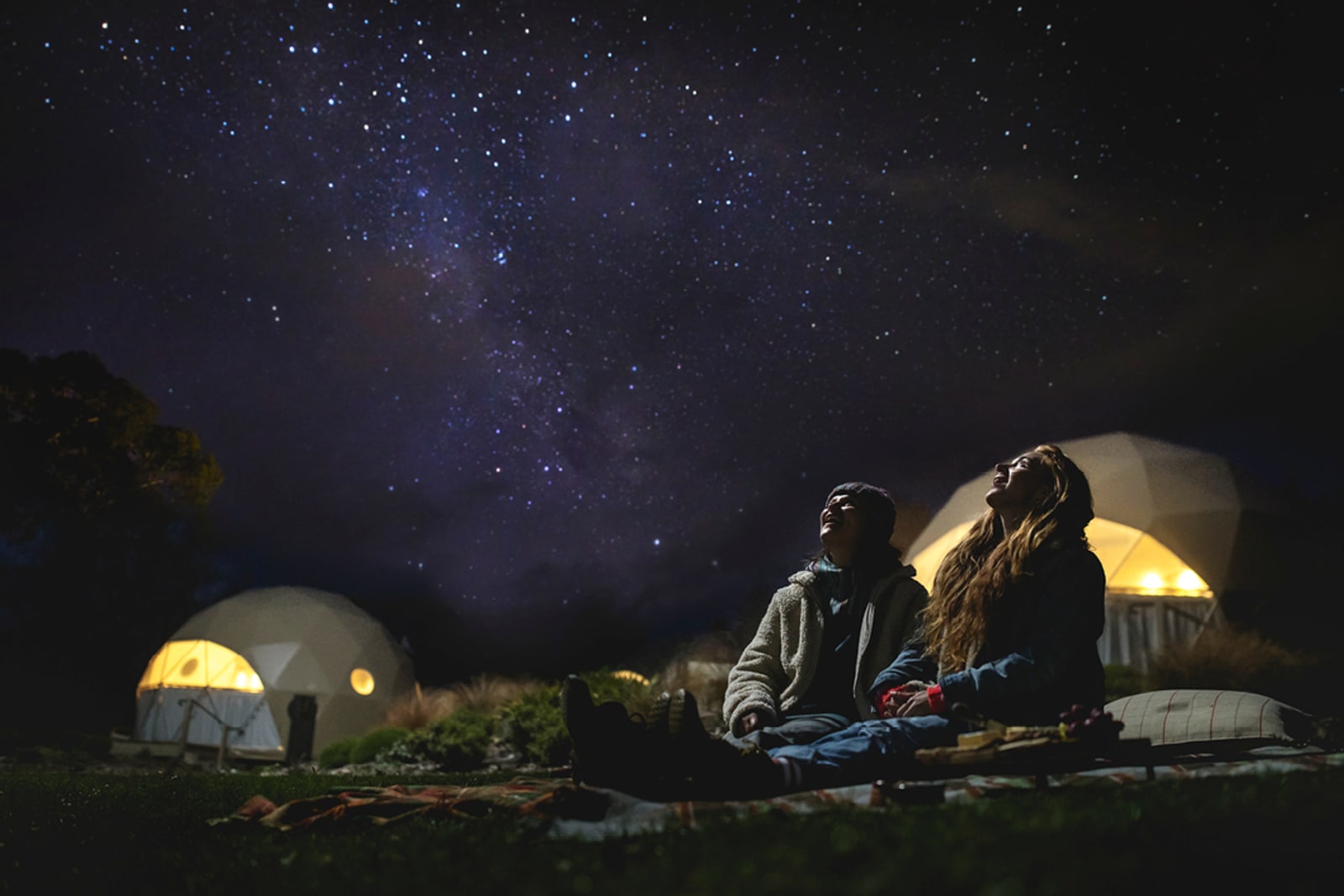Two people stargazing at the world's largest dark sky reserve in Aoraki