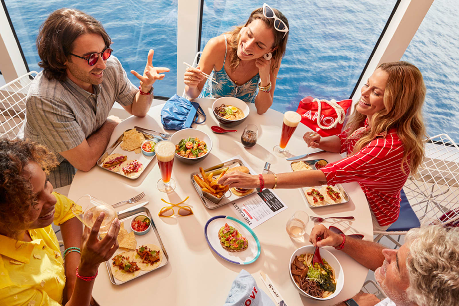 A group of friends enjoying a meal on a cruise