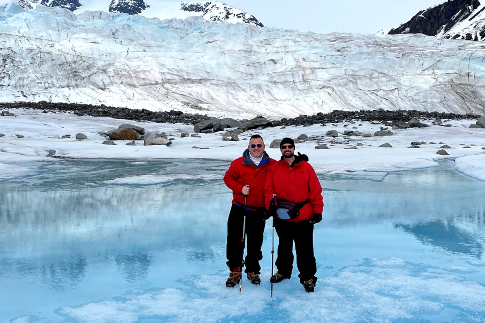Flight Centre travel consultant Brett Siborne stands on the Mendenhall Glacier with his partner