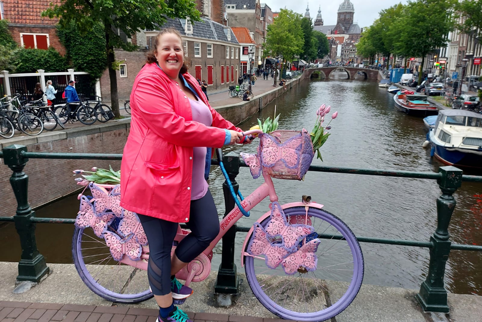 Flight Centre travel consultant Erin Dougan riding a bike in Amsterdam