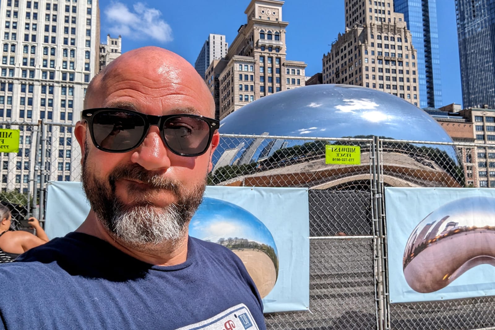 Flight Centre travel consultant Omar Guechtal poses for a selfie in front of "The Bean" in Chicago
