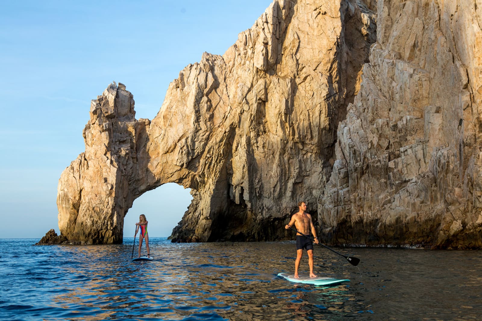 Two people paddleboarding at El Arco in Los Cabos
