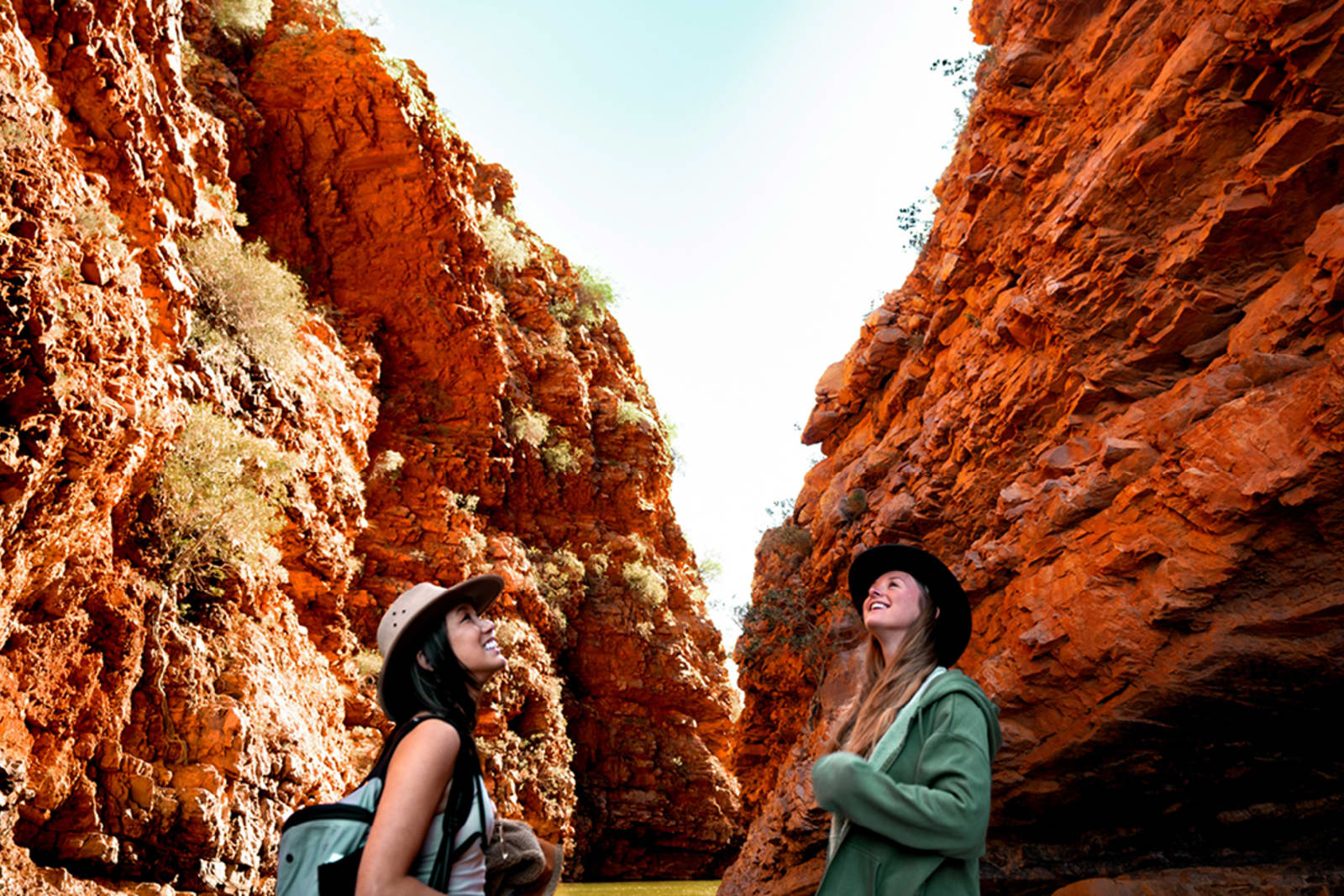 Travellers looking up at Kings Canyon in Australia