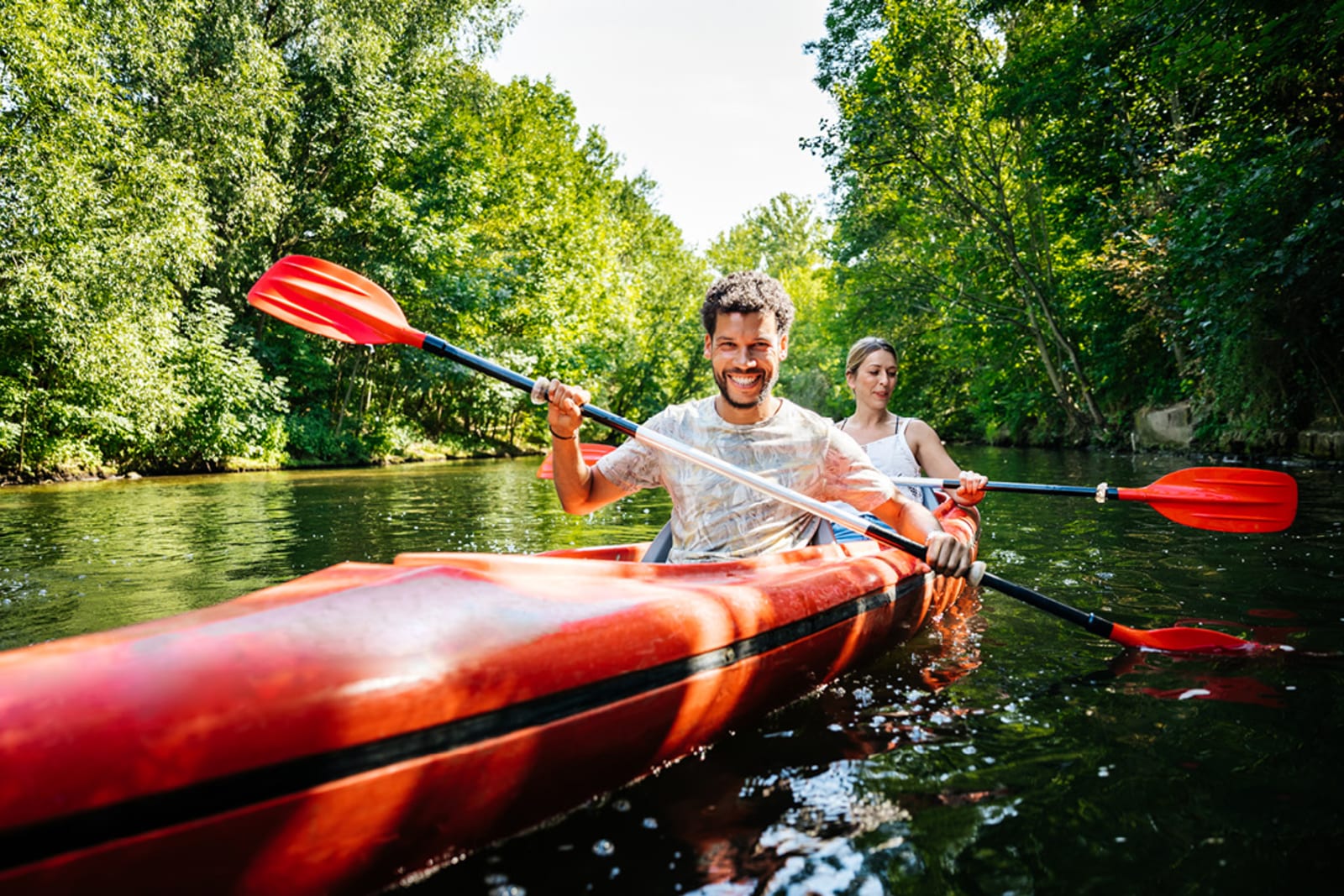 Travellers kayaking in an ecotourism destination