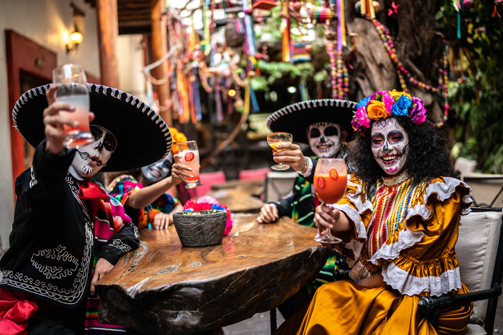 A group of people celebrating Día De Los Muertos (Day of the Dead)