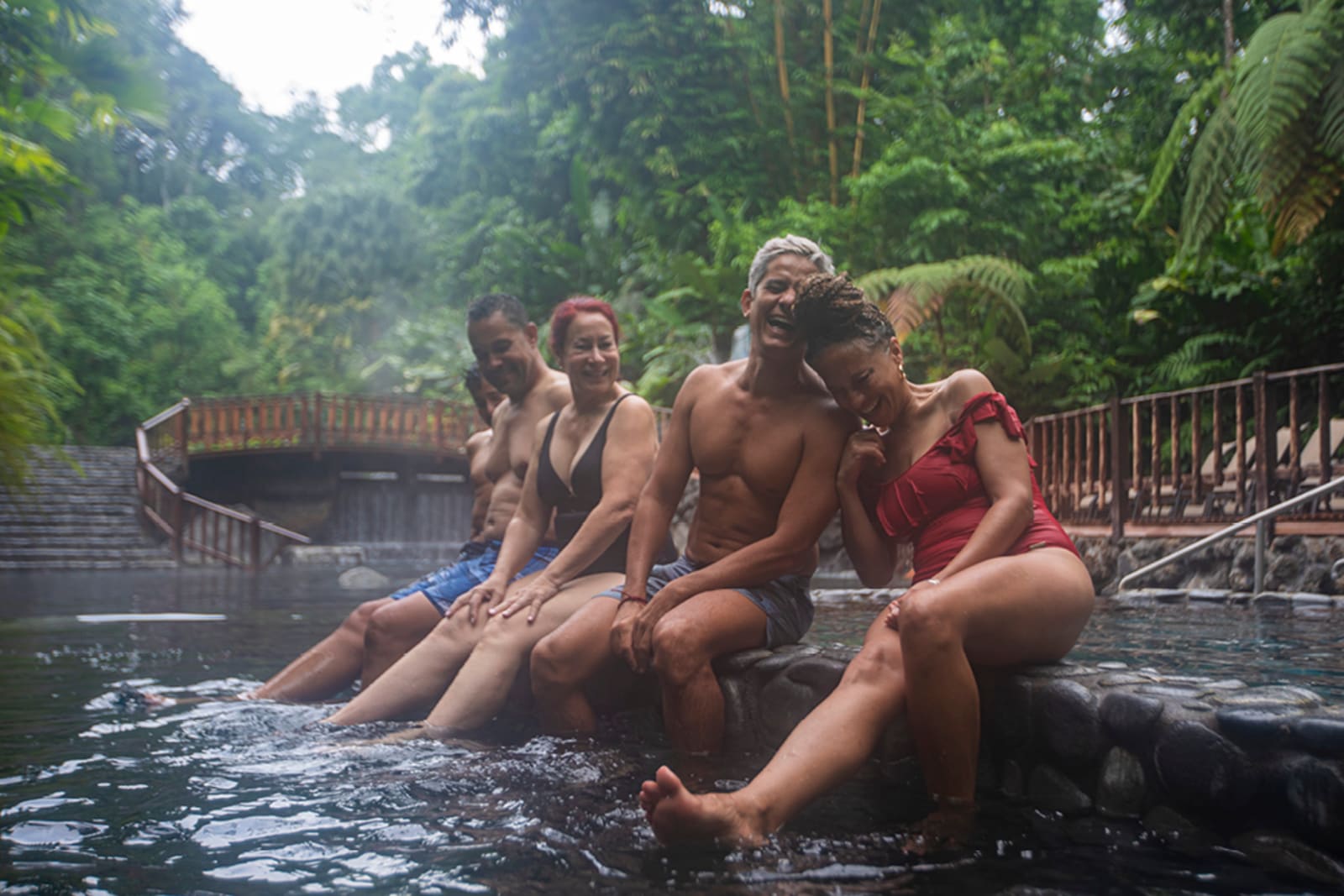A group on a tour enjoying a hot spring in Costa Rica
