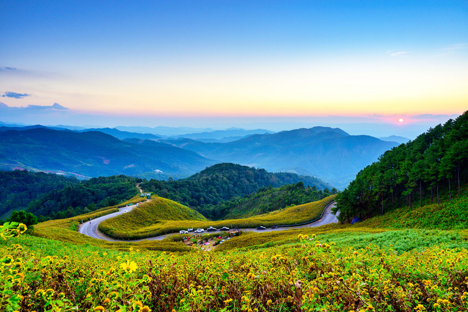 Cars driving on the Mae Hong Son Loop — one of Thailand's best road trip routes