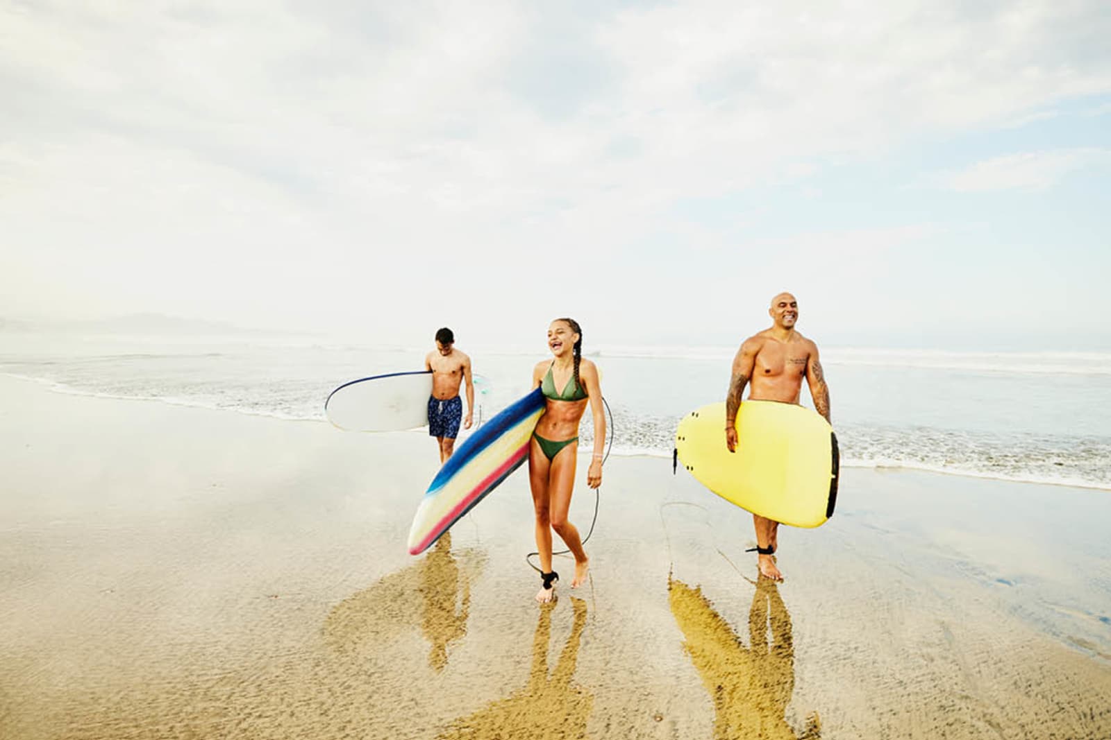 A family surfing while on vacation