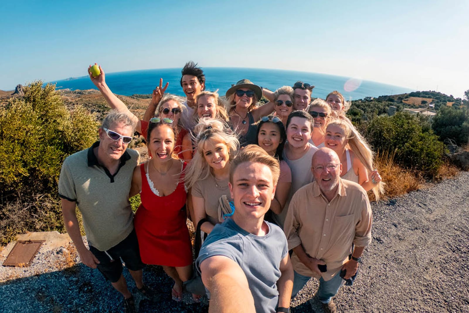 Large family posing for a photo while on a group trip