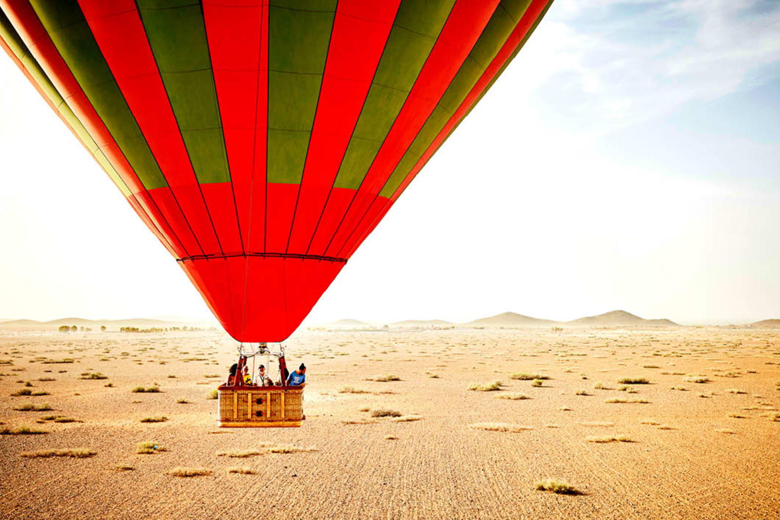 Friends on a hot air balloon ride during a group trip