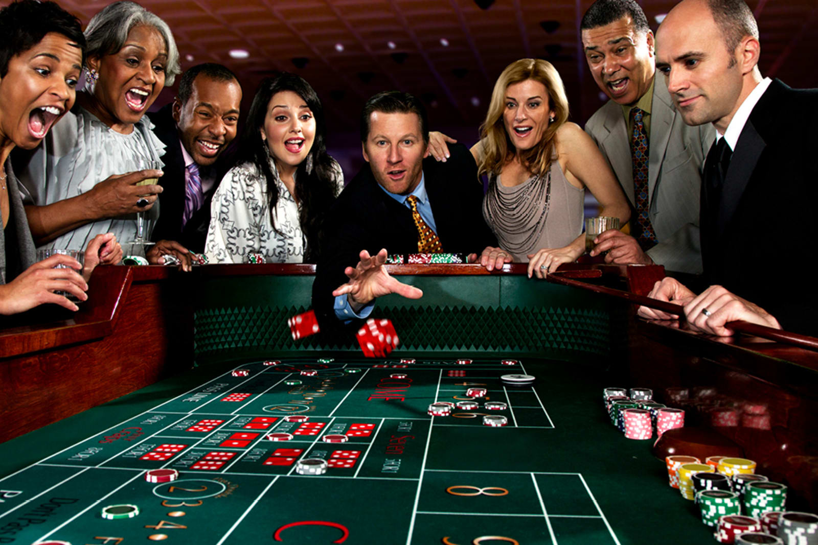 A group of people playing craps in a Las Vegas casino