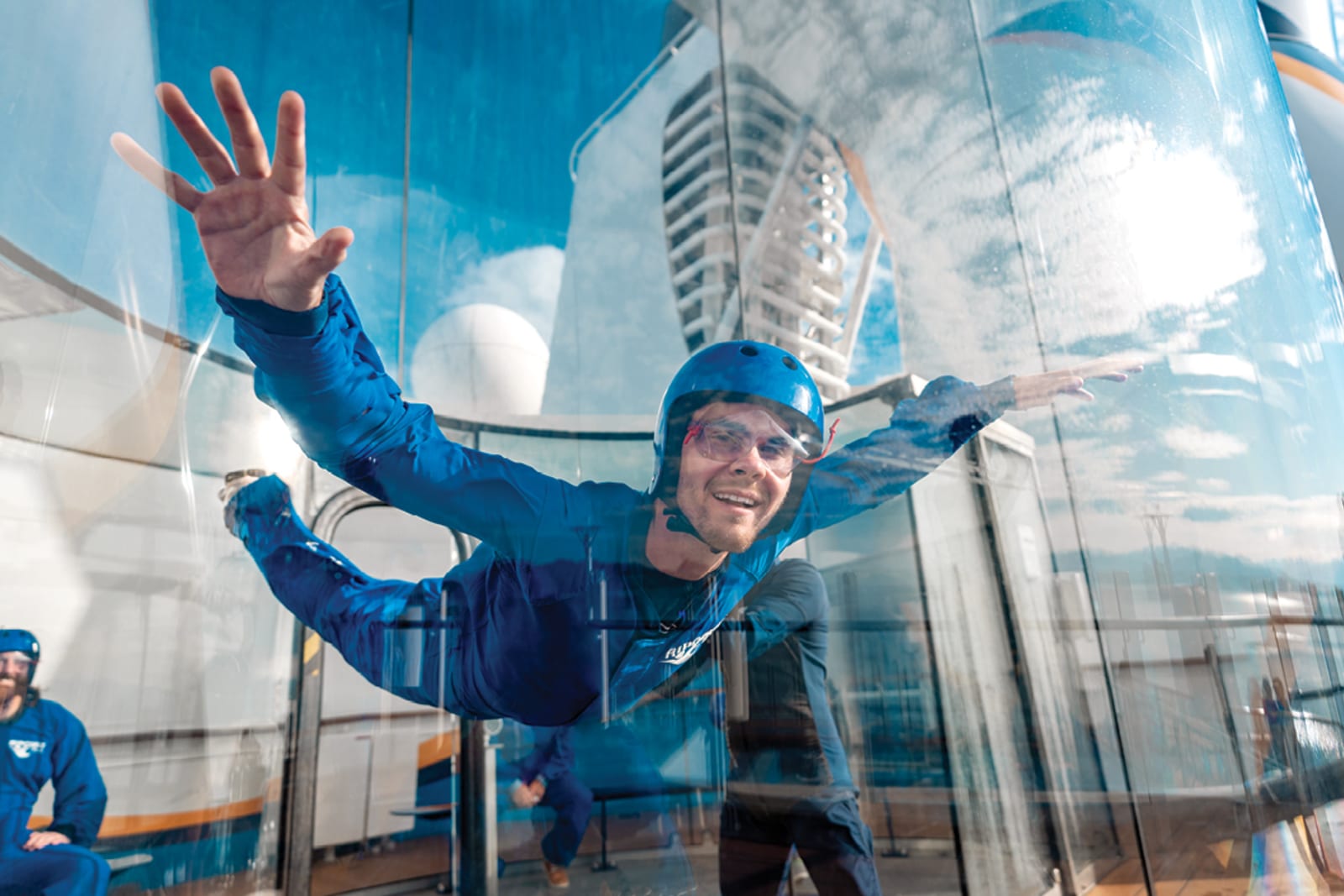 A passenger enjoying the skydiving simulator aboard Royal Caribbean International ship