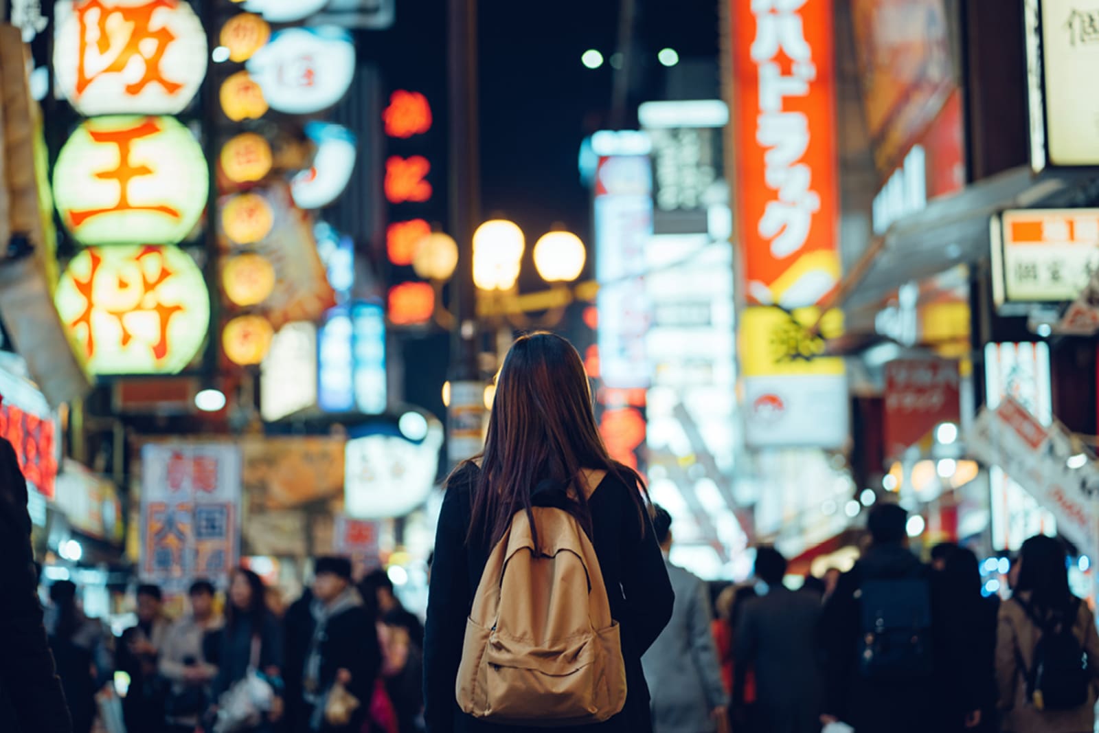 Woman on a neon-lit street in Japan