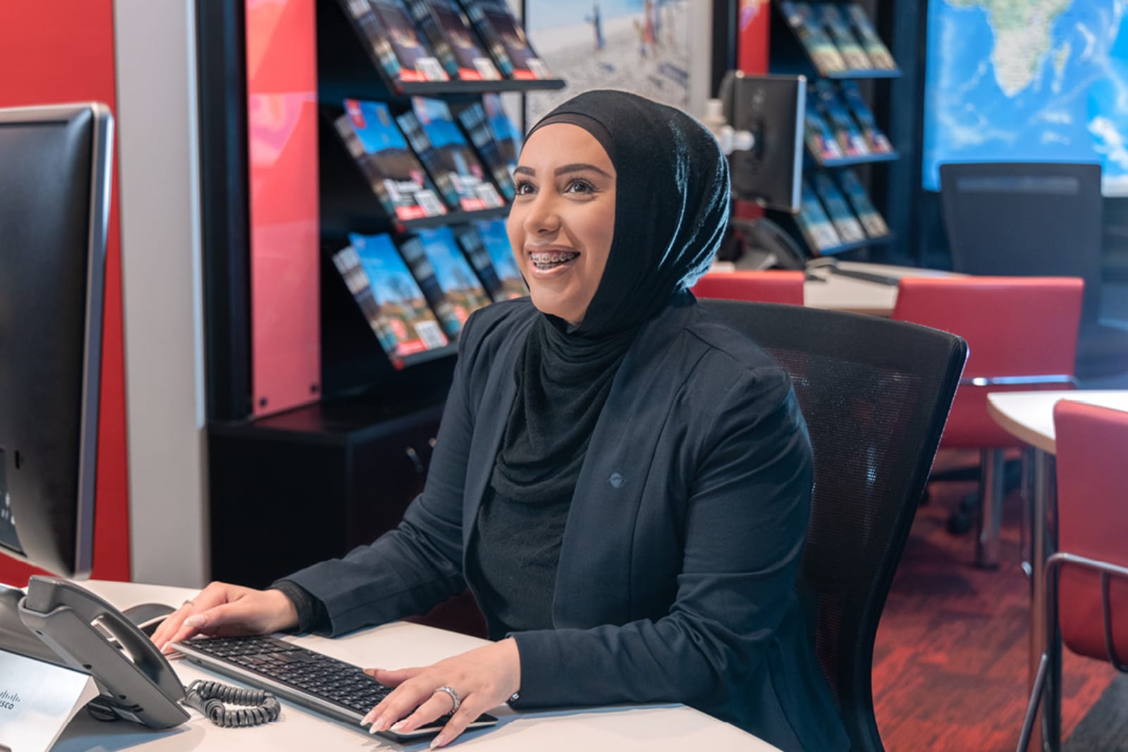 A Flight Centre Travel Expert in a store