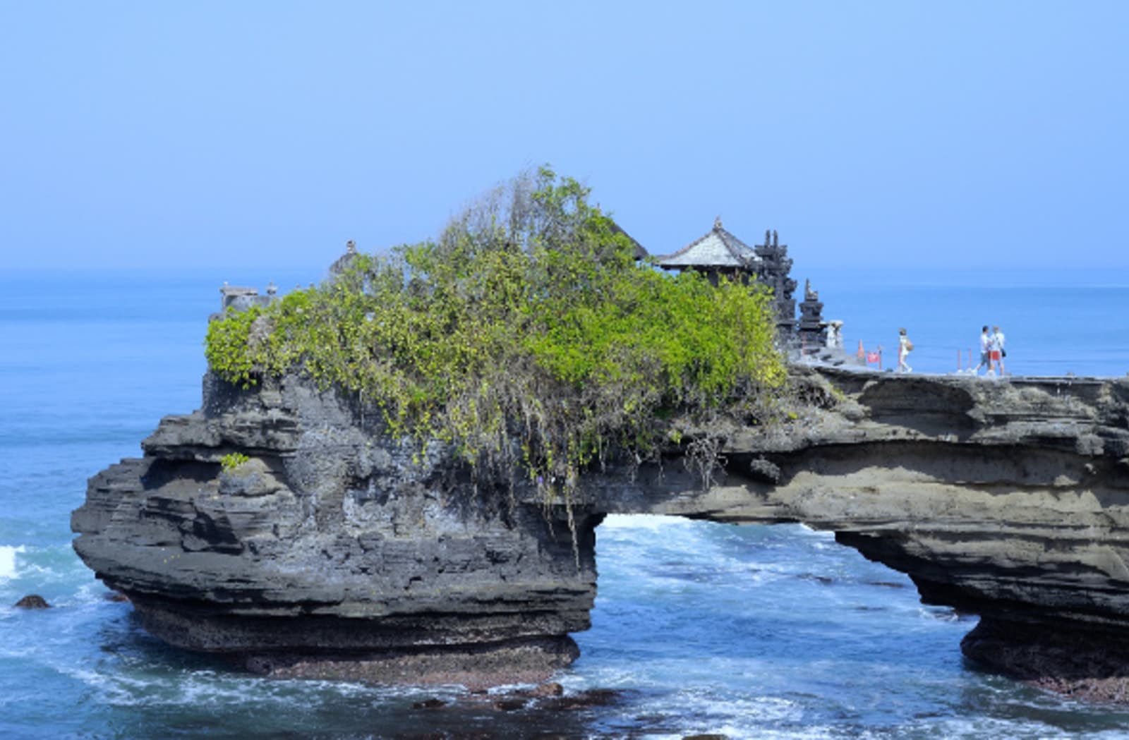 Pura Tanah Lot, perched on a shrub-covered rock at sea