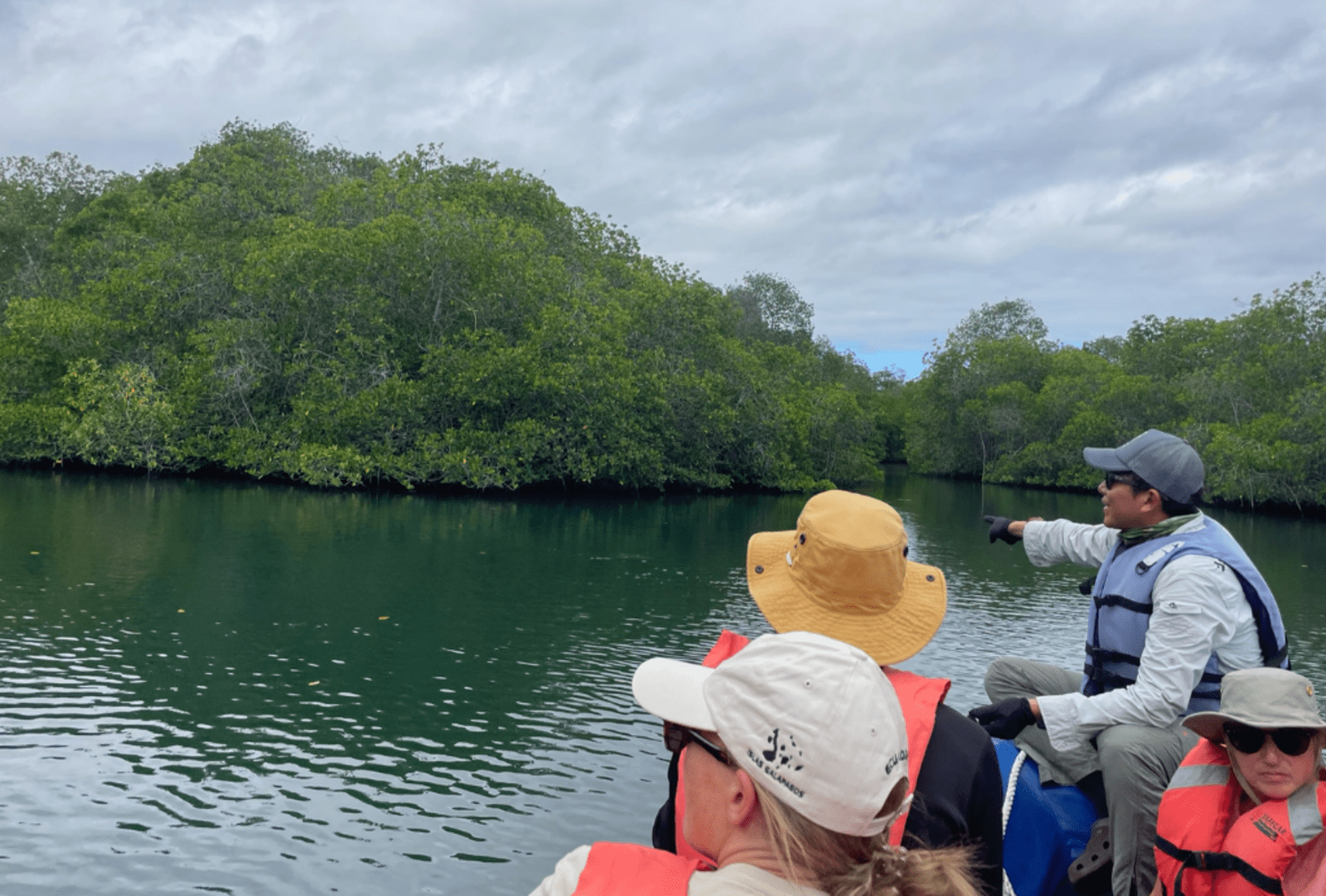 A group tour aboard a boat off the Galapagos Islands.