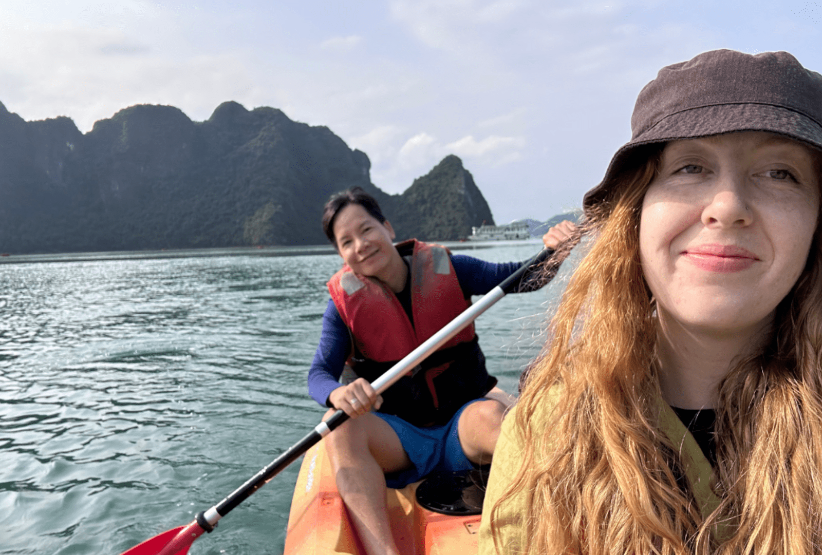 Emma and Thao kayaking in Ha Long Bay