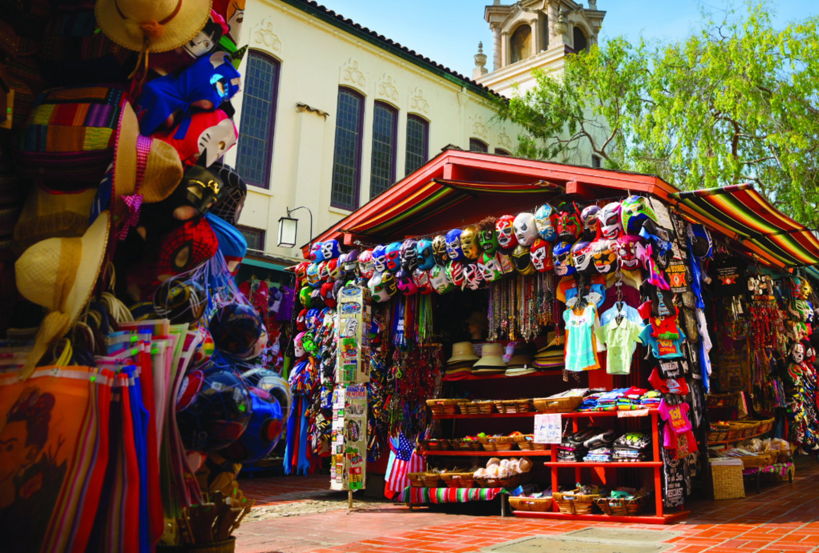 Bright masks for sale at an outdoor stall on Olvera Street