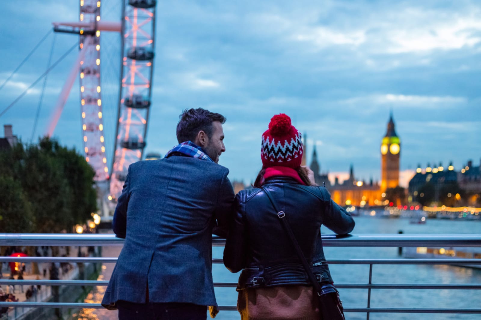 Couple in London with London Eye and Big Ben in the background