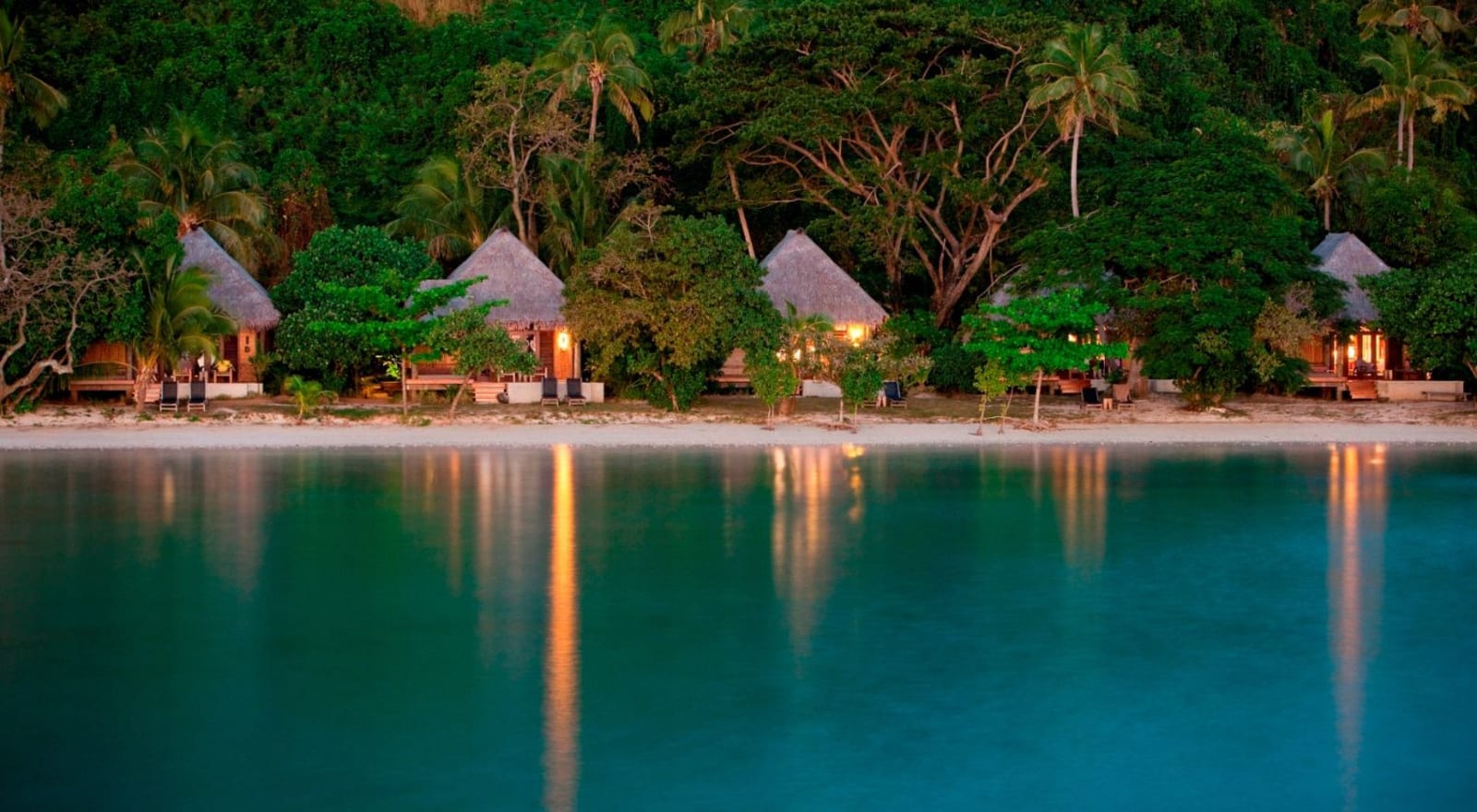 Luxury bungalows on the edge of a beach in Fiji