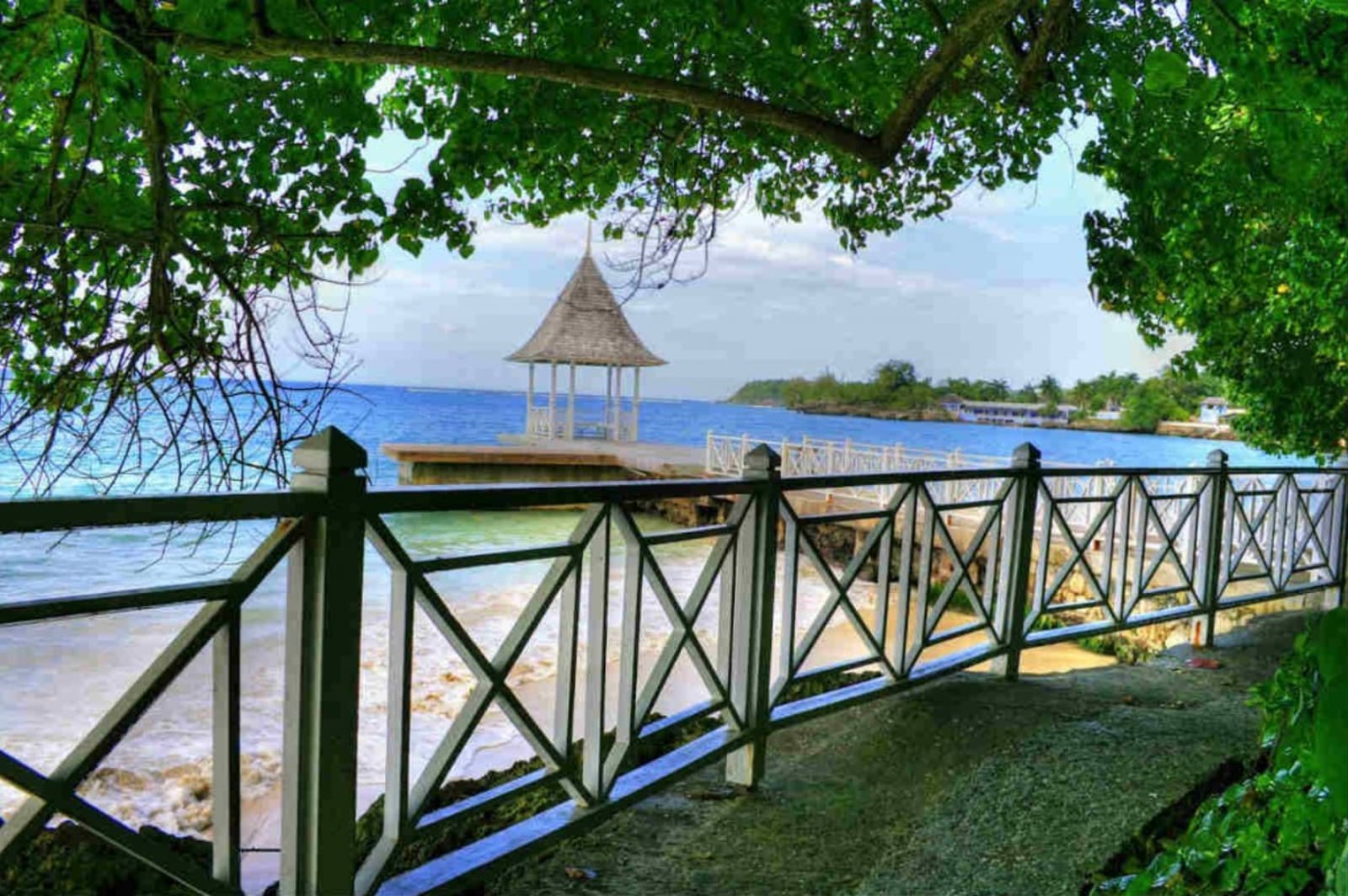 Small gazebo on a pier lined with white square walls