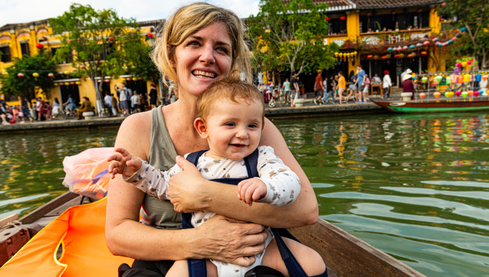 Mother and baby in boat in Hoi An