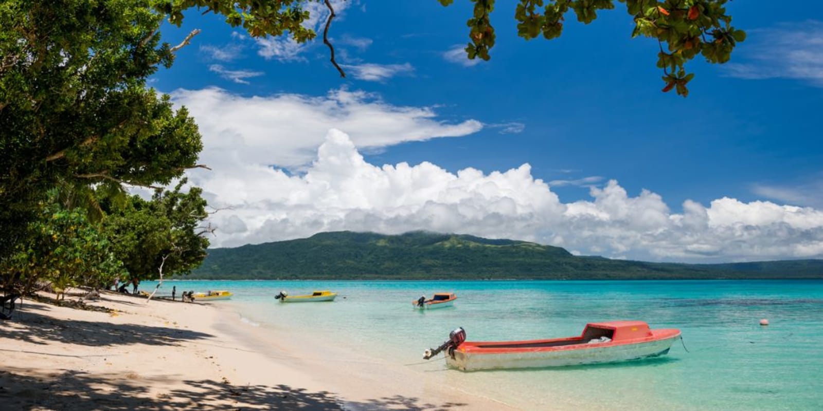 Boats parked on a sandy beach in Vanuatu