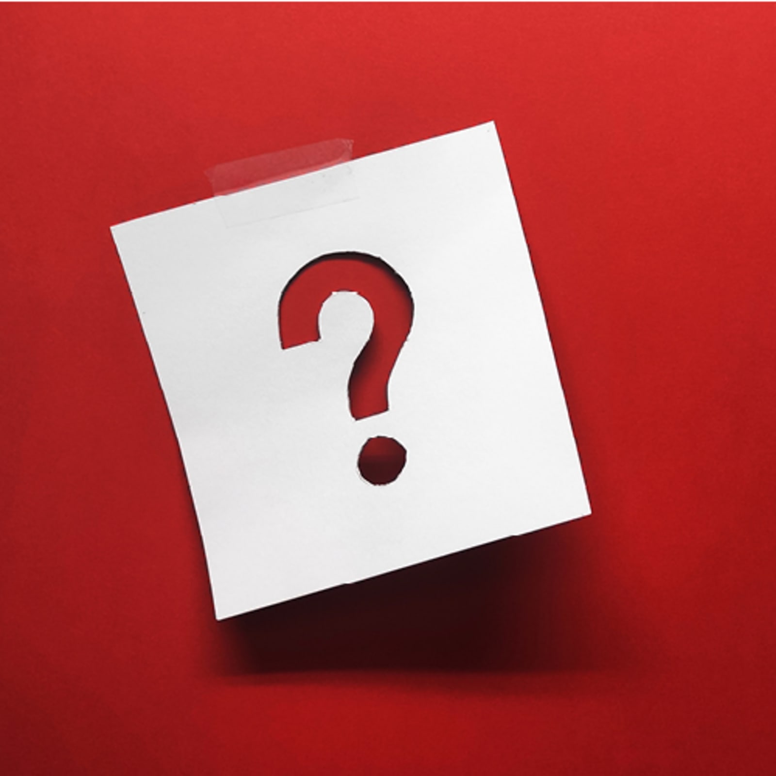 Red background with sticky note that has a question mark
