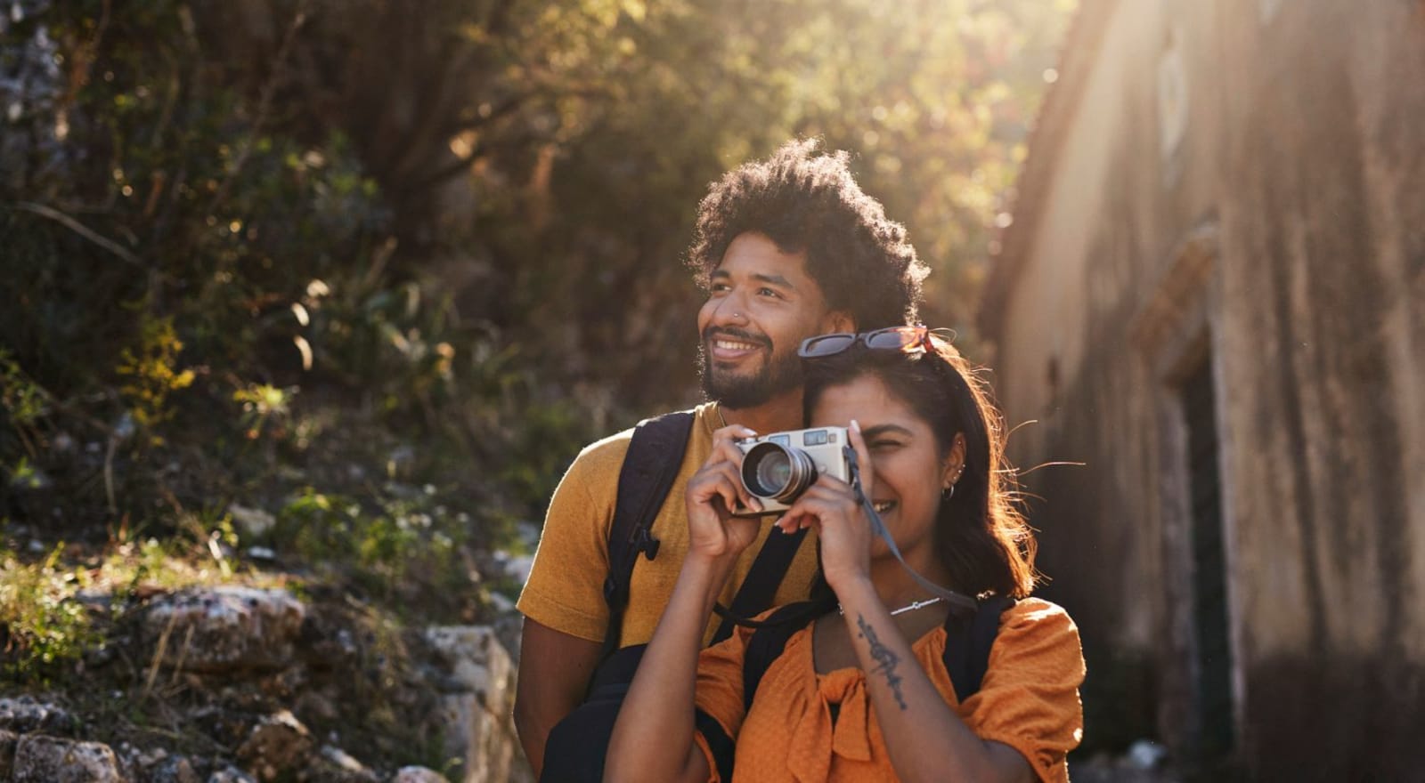 couple standing together while lady takes photo