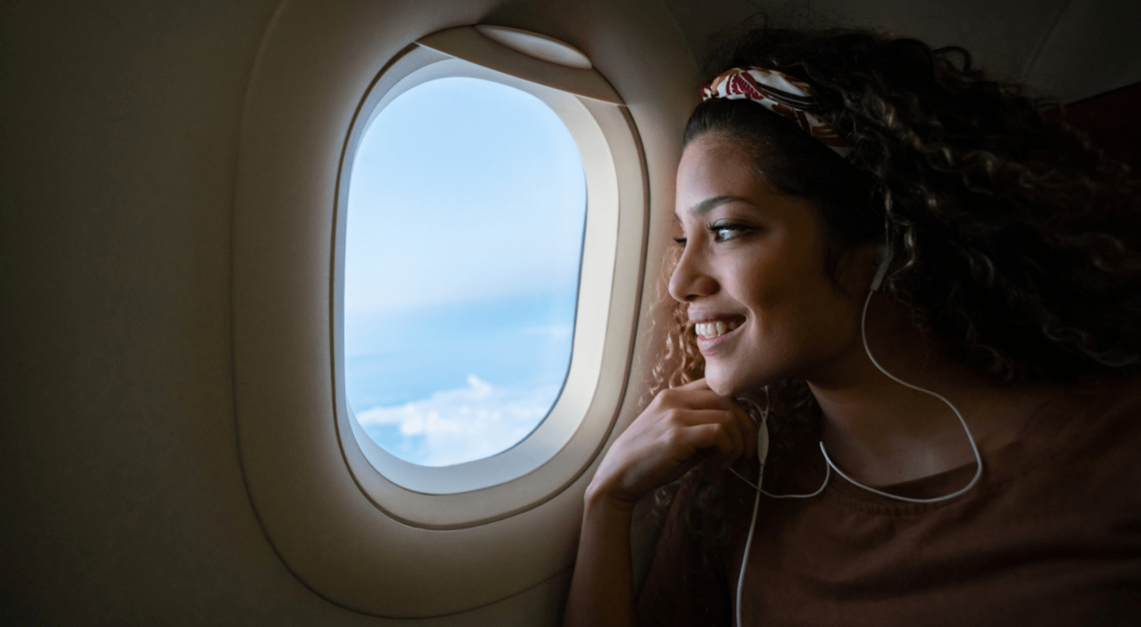 lady looking out plane window