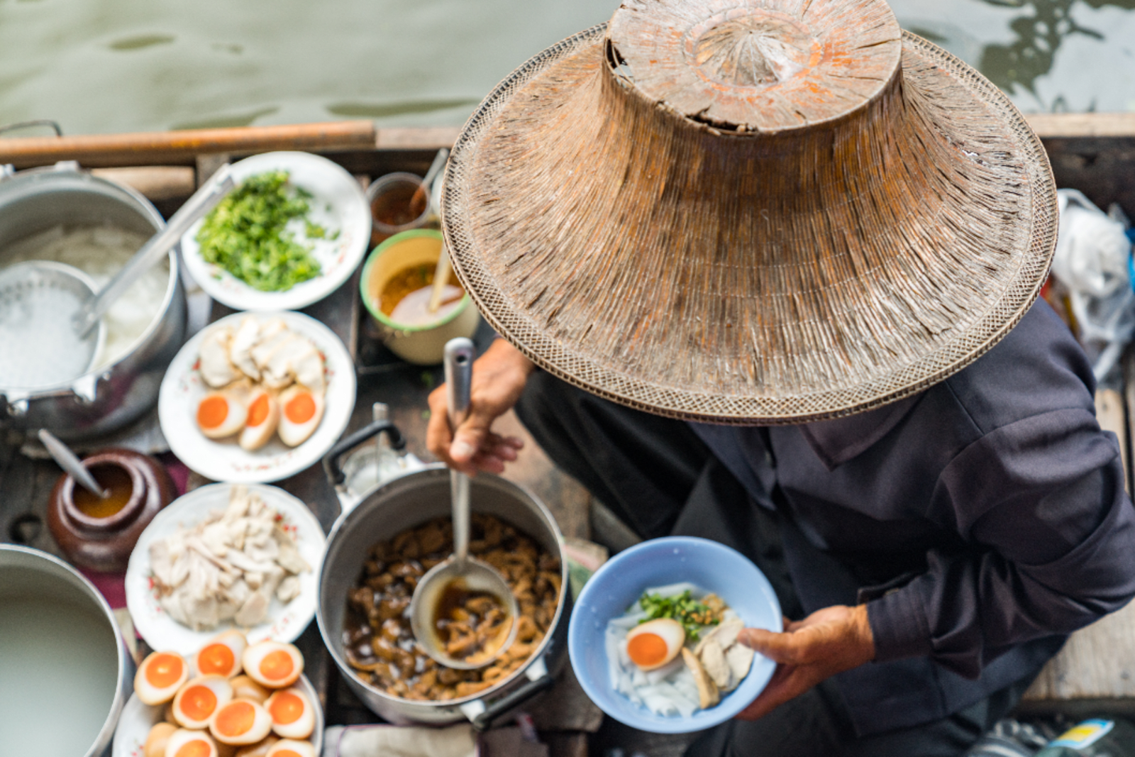 A trip to Thailand would be incomplete without trying food from a floating market
