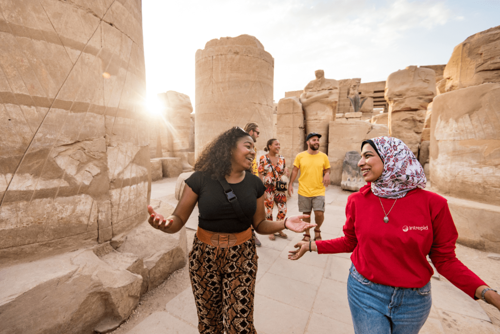 An Intrepid guide exploring one of Egypt's many ancient wonders with a group of travellers