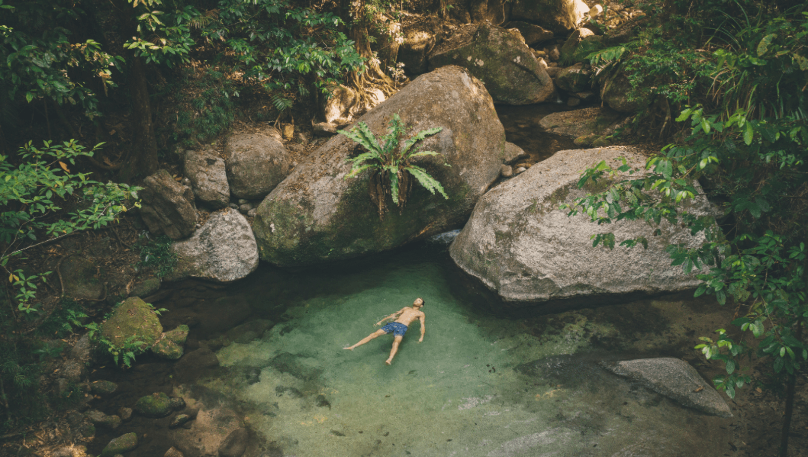 person floats in mossman gorge