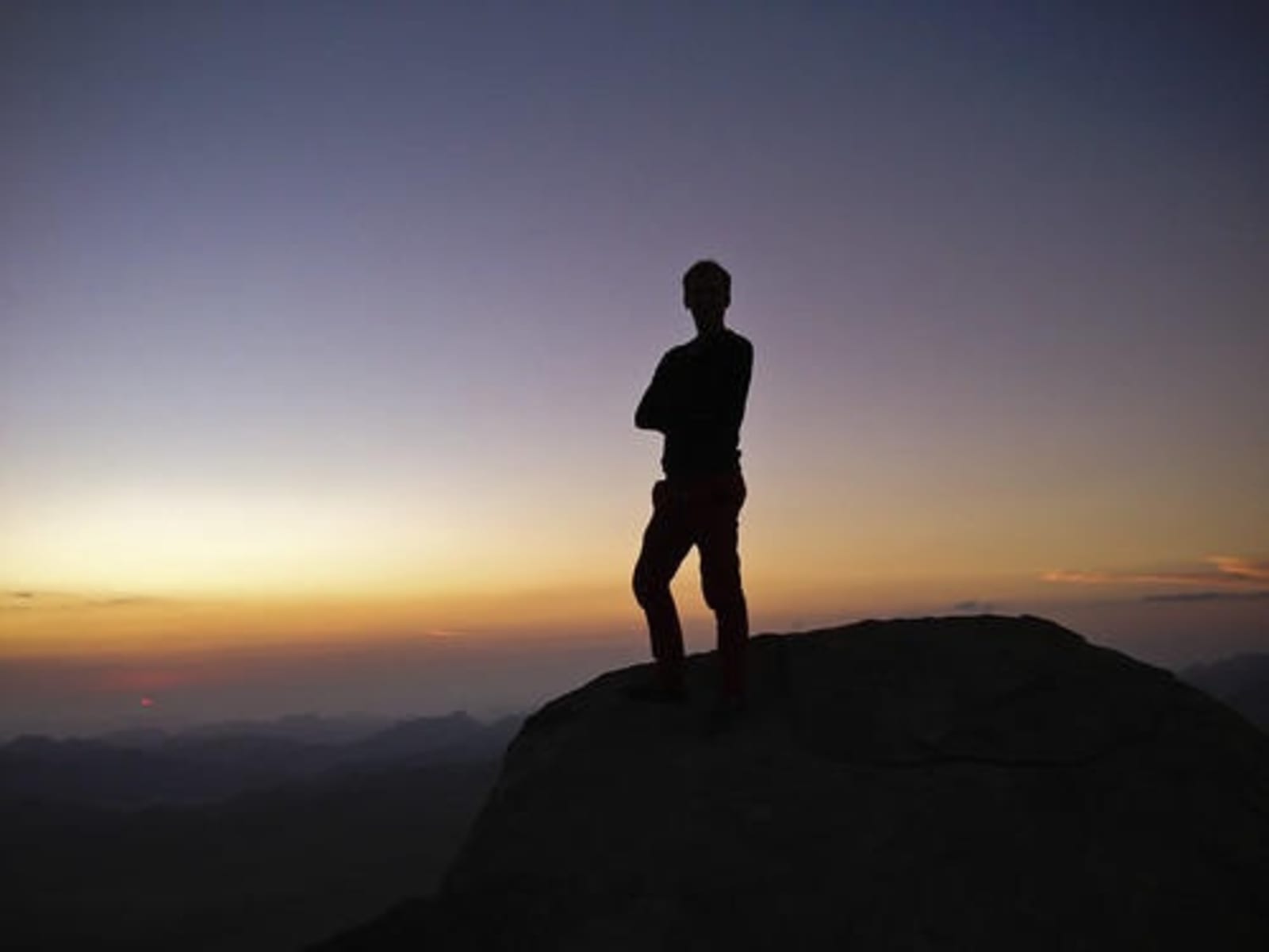 Man standing on top of Mt Sinai.