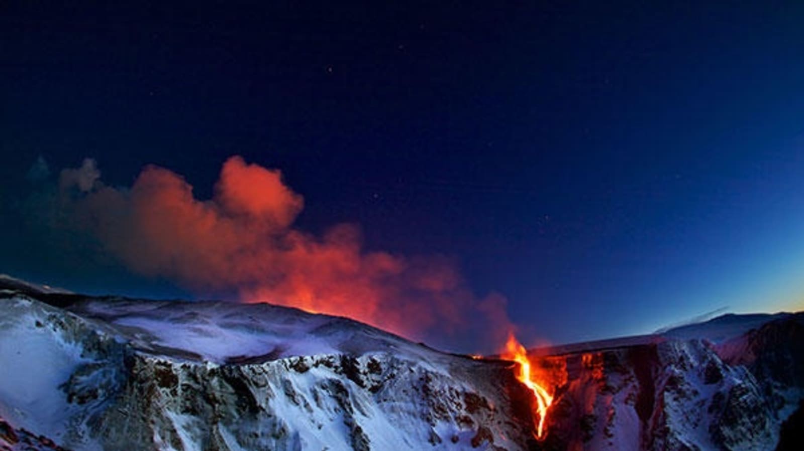  Eyjafjallajokull volcano erupting at night.