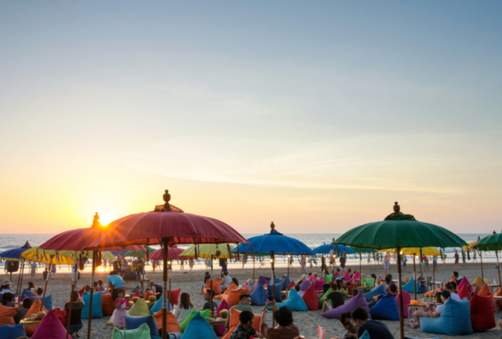 Sunset over beach diners on Seminyak Beach, Bali