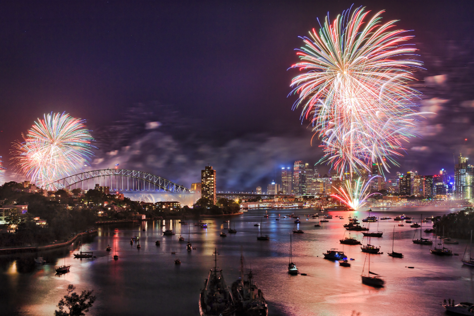 Sydney New Year's Eve fireworks over Harbour with bridge and city