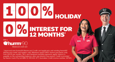Flight Centre consultant and pilot smiling beside a humm90 Mastercard offer for 100% holiday at 0% interest for 12 months